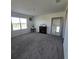 Light filled bonus room featuring a charming fireplace and mirror, creating a cozy atmosphere at 1114 Brimstone Cir, Winter Haven, FL 33884