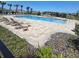 Inviting community pool area with lounge chairs, offering a refreshing oasis for residents at 1114 Brimstone Cir, Winter Haven, FL 33884