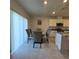 Bright dining area featuring tile flooring, a modern chandelier, and lots of natural light at 1114 Brimstone Cir, Winter Haven, FL 33884