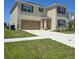Charming two-story home featuring a spacious two car garage and well-maintained landscaping at 1114 Brimstone Cir, Winter Haven, FL 33884
