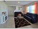 Comfortable living room with tile flooring, cozy seating, and lots of natural light at 1114 Brimstone Cir, Winter Haven, FL 33884