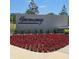 Entrance to the Harmony neighborhood with vibrant flower beds at 1114 Brimstone Cir, Winter Haven, FL 33884