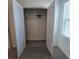 Spacious walk-in closet featuring carpet floors, wire shelving, and ample storage space at 1114 Brimstone Cir, Winter Haven, FL 33884