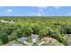 An aerial view of the home in a wooded community at 11569 Sw 75Th Cir, Ocala, FL 34476