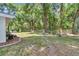 Spacious backyard with mature trees and lush green grass at 11569 Sw 75Th Cir, Ocala, FL 34476