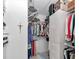 Walk-in closet with plenty of storage shelving, hanging racks and cabinets at 11569 Sw 75Th Cir, Ocala, FL 34476