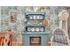 A bright dining area features a decorative cabinet with a light blue background and wooden dining chairs at 11569 Sw 75Th Cir, Ocala, FL 34476