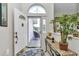 Inviting entryway with decorative console table and view of outdoor patio at 11569 Sw 75Th Cir, Ocala, FL 34476