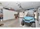 The garage is complete with storage and an electric golf cart at 11569 Sw 75Th Cir, Ocala, FL 34476