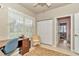 Cozy office with a woven chair, desk, and closet, perfect for a home workspace at 11569 Sw 75Th Cir, Ocala, FL 34476