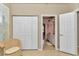 Office featuring a woven chair and a closet, leading to a bathroom at 11569 Sw 75Th Cir, Ocala, FL 34476