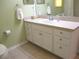 Bathroom with a vanity offering both drawer and cabinet space for storage at 11628 Sw 140Th Loop, Dunnellon, FL 34432