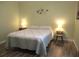 Bedroom featuring a bed with nightstands and decorative wall art at 11628 Sw 140Th Loop, Dunnellon, FL 34432