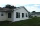 Home's exterior boasts ample windows and vinyl siding offering a bright and low-maintenance design at 11628 Sw 140Th Loop, Dunnellon, FL 34432