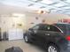 This garage has the laundry area and a black SUV parked inside at 11628 Sw 140Th Loop, Dunnellon, FL 34432
