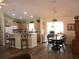Modern kitchen featuring stainless steel appliances, ample counter space, and an adjoining dining area at 11628 Sw 140Th Loop, Dunnellon, FL 34432