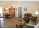 Open-concept living area with dining space, comfortable seating, and plenty of natural light at 11628 Sw 140Th Loop, Dunnellon, FL 34432
