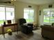 Cozy living room with lots of natural light, modern floors, and comfortable seating at 11628 Sw 140Th Loop, Dunnellon, FL 34432