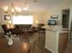 Bright and spacious living room with large windows, comfortable seating, and stylish decor at 11628 Sw 140Th Loop, Dunnellon, FL 34432