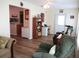 Open-concept living room with office space, tile floors, and lots of natural light at 11628 Sw 140Th Loop, Dunnellon, FL 34432