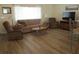 Comfortable living room with plush seating, lots of light, and modern flooring at 11628 Sw 140Th Loop, Dunnellon, FL 34432