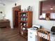 Bright office space with built-in shelves, adjacent to the living area, and tile floors at 11628 Sw 140Th Loop, Dunnellon, FL 34432