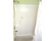 Shower over tub, features tile surround, shower curtain, and recessed shelf at 11628 Sw 140Th Loop, Dunnellon, FL 34432