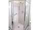 Shower stall with glass doors, grab bars, and shower head at 11628 Sw 140Th Loop, Dunnellon, FL 34432