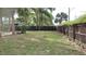 Spacious fenced in backyard with mature trees provides privacy and shade at 12 Brook Pl, Ocala, FL 34472