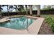 Inviting pool with stairs for easy access and a concrete patio area for sunbathing at 12 Brook Pl, Ocala, FL 34472