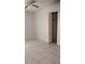 Neutral bedroom with fan, tile floors, and closet, creating a calming retreat at 12 Brook Pl, Ocala, FL 34472