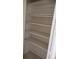 White closet with shelving and hanging rod for optimal storage at 12 Brook Pl, Ocala, FL 34472