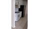 White kitchen featuring an electric stove, white cabinets, and stainless steel refrigerator at 12 Brook Pl, Ocala, FL 34472