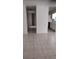 Open concept living space with tile floors connecting to a kitchen area at 12 Brook Pl, Ocala, FL 34472