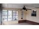 Enclosed patio featuring a ceiling fan with a view of the backyard at 12 Brook Pl, Ocala, FL 34472