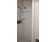 Shower stall featuring white tiled walls and an adjustable showerhead at 12 Brook Pl, Ocala, FL 34472
