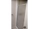 Bathroom features a shower with a frosted glass door and tiled walls at 12 Brook Pl, Ocala, FL 34472