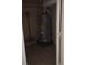 Water heater inside utility closet with shelving and tiled floor at 12 Brook Pl, Ocala, FL 34472