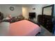 Bedroom featuring two beds, dresser, TV, and decorative accents for a cozy feel at 12 Hickory Course Way, Ocala, FL 34472