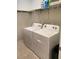 Laundry room with new white washer and dryer at 12 Hickory Course Way, Ocala, FL 34472