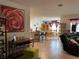 Open-concept living space featuring a kitchen island, dining area, and comfortable seating, perfect for modern living at 12 Hickory Course Way, Ocala, FL 34472