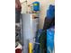 Water heater with plumbing and assorted storage items at 12 Hickory Course Way, Ocala, FL 34472