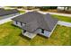 Backyard features a well-maintained lawn, privacy fence, and a covered patio at 12180 Se 89Th Ter, Belleview, FL 34420