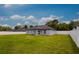 Expansive backyard featuring lush green grass and a privacy fence at 12180 Se 89Th Ter, Belleview, FL 34420