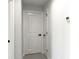 Bright hallway with white walls and doors plus modern hardware at 12180 Se 89Th Ter, Belleview, FL 34420