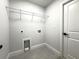 Clean laundry room with tile floors, washer and dryer hookups and shelving for storage at 12180 Se 89Th Ter, Belleview, FL 34420
