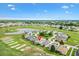 Aerial view of the community highlighting its golf course, water features, and residential layout at 12255 Se 177Th Loop, Summerfield, FL 34491