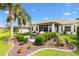 Well-maintained backyard features patio seating, lush landscaping, and a serene atmosphere at 12255 Se 177Th Loop, Summerfield, FL 34491