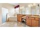 Bathroom with dual vanities, walk-in shower and soaking tub at 12255 Se 177Th Loop, Summerfield, FL 34491