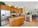 Modern kitchen featuring stainless steel appliances, granite countertops, and an island at 12255 Se 177Th Loop, Summerfield, FL 34491